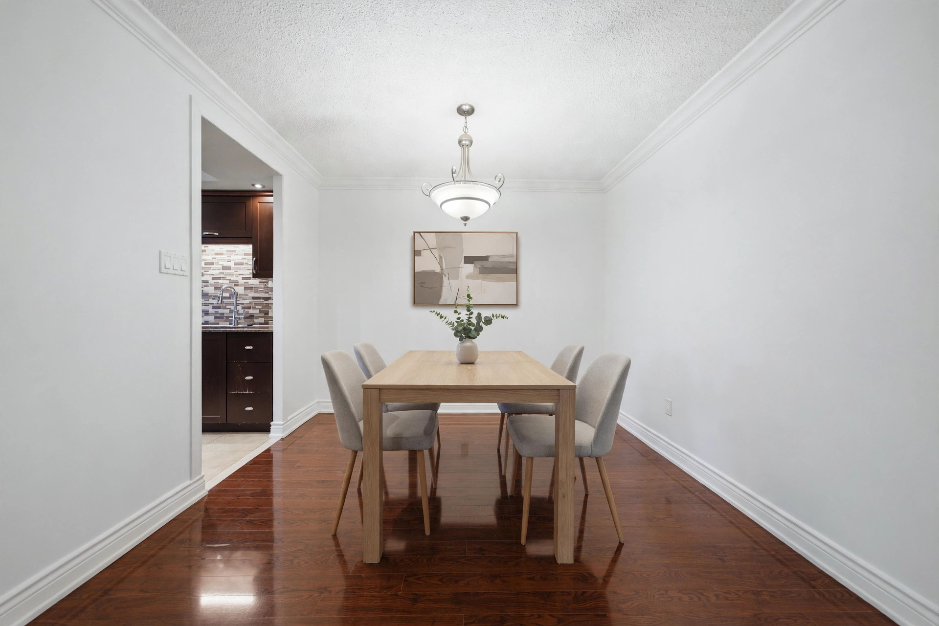 Virtually staged dining room with table and chairs