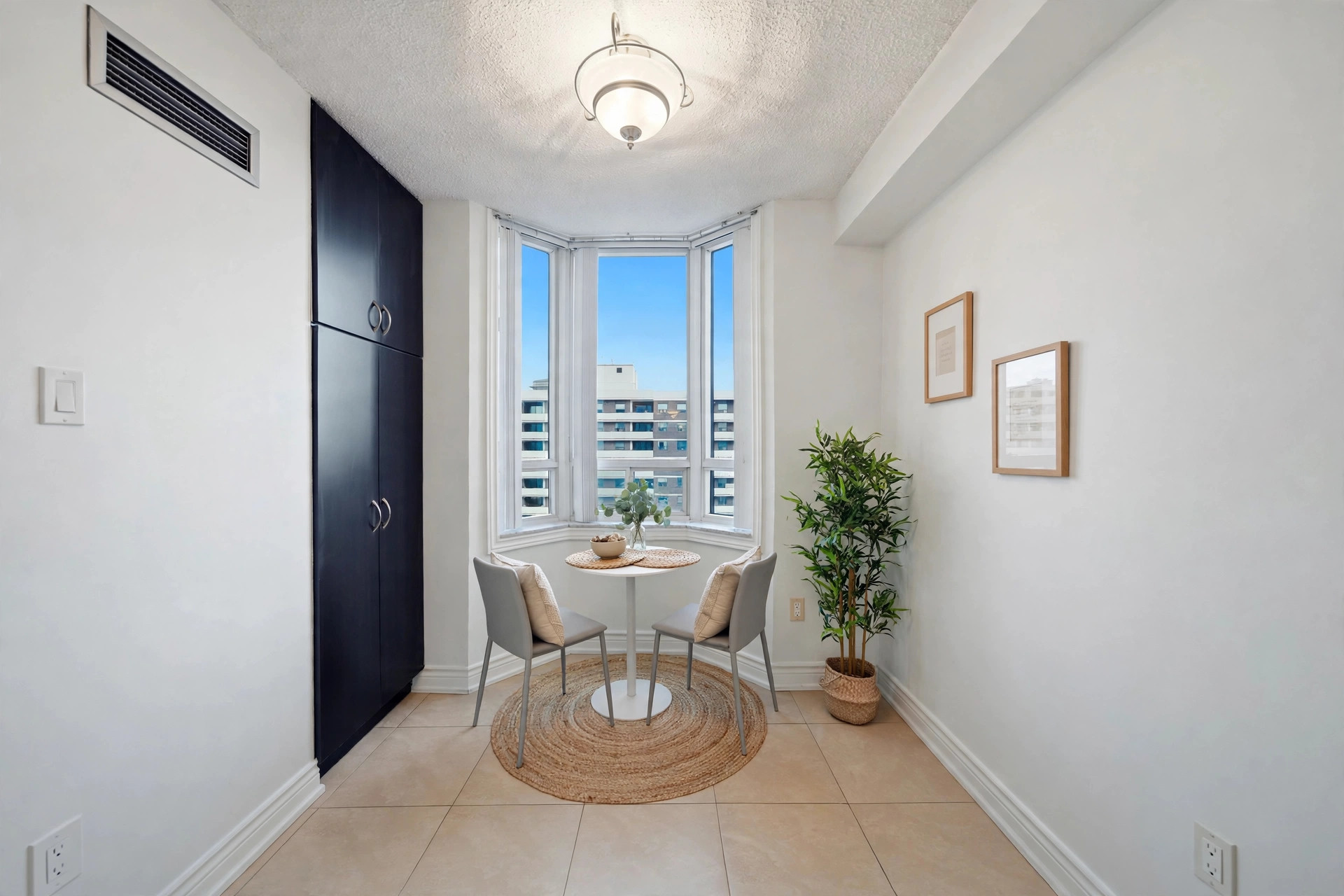 Virtually staged breakfast nook with bay window and built-in storage