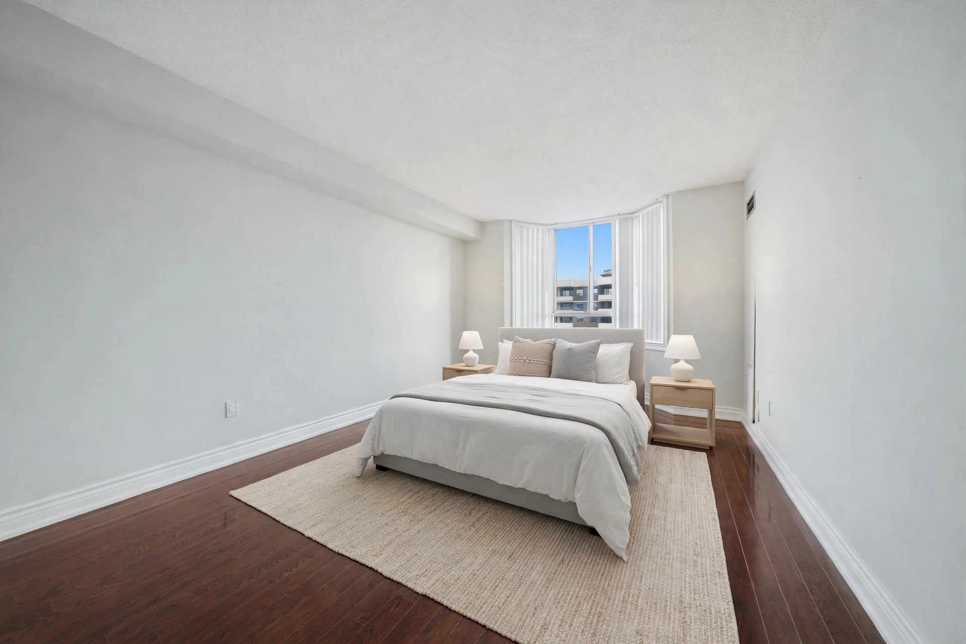 Virtually staged bedroom with a bed beside the bay windows