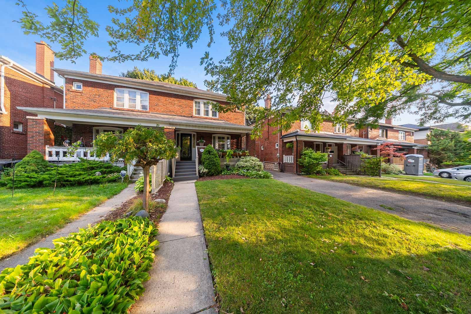 Brick home at 171 Melrose Avenue beneath mature trees