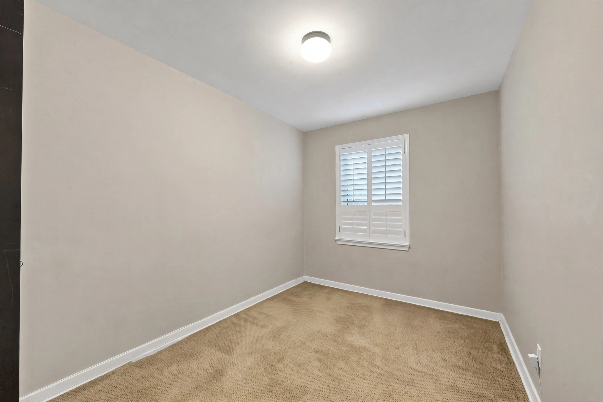 Bedroom with plantation shutters