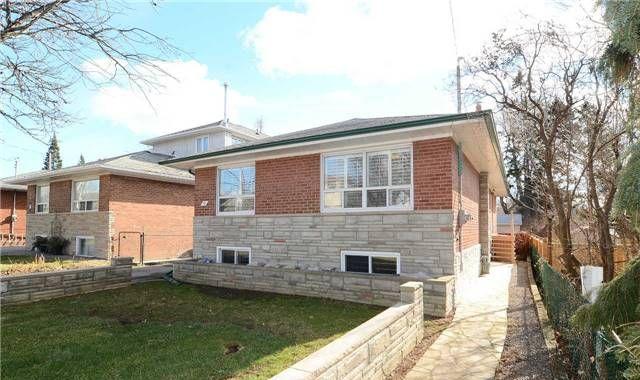 Front exterior of the all-brick raised bungalow at 35 Florens Avenue