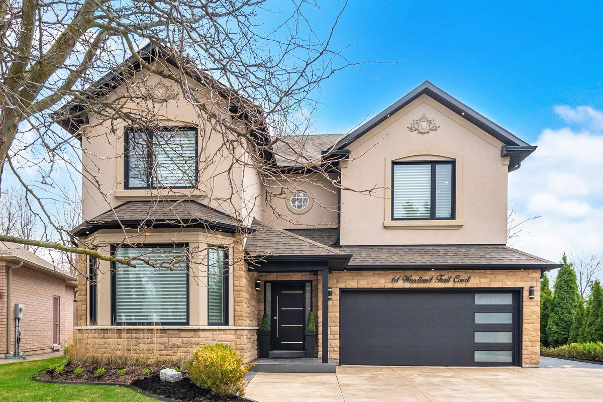 Front exterior of the detached home at 61 Woodland Trail Court in Vaughan