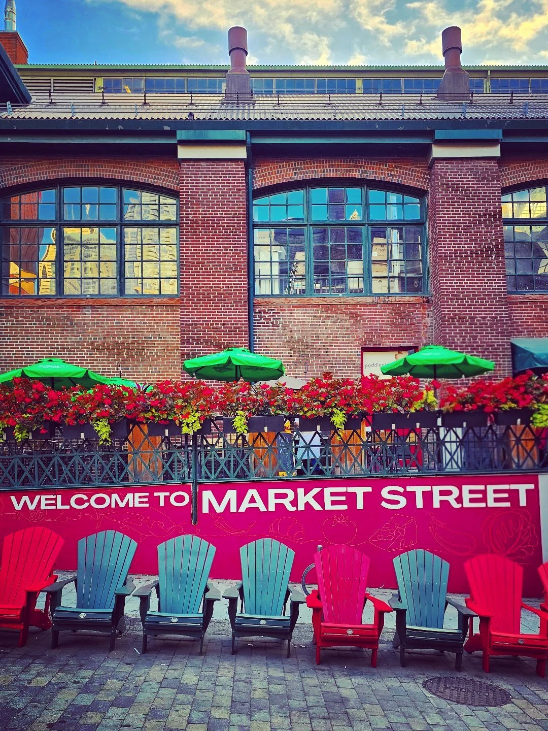Market Street in St. Lawrence, Toronto, with colourful chairs and historic brick buildings