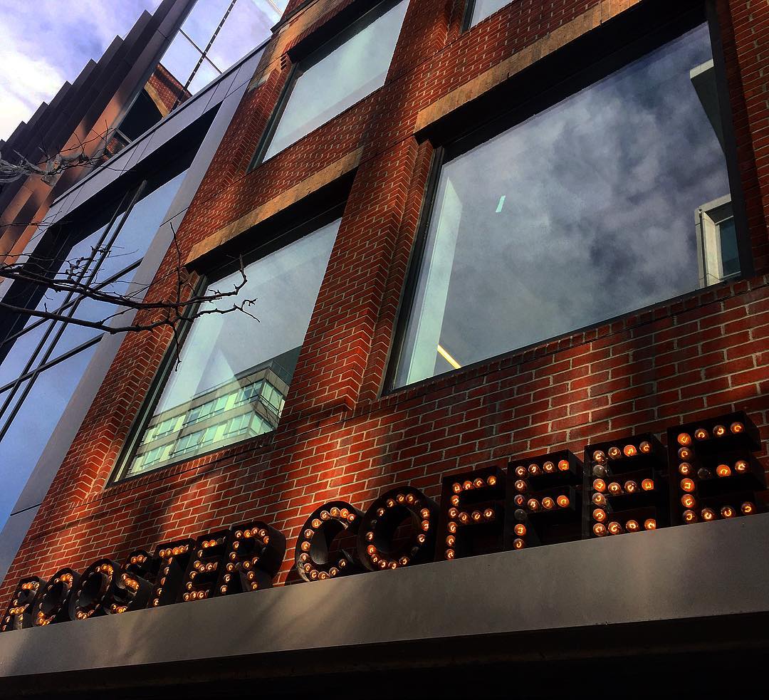Rooster Coffee marquee sign on King Street West, Toronto