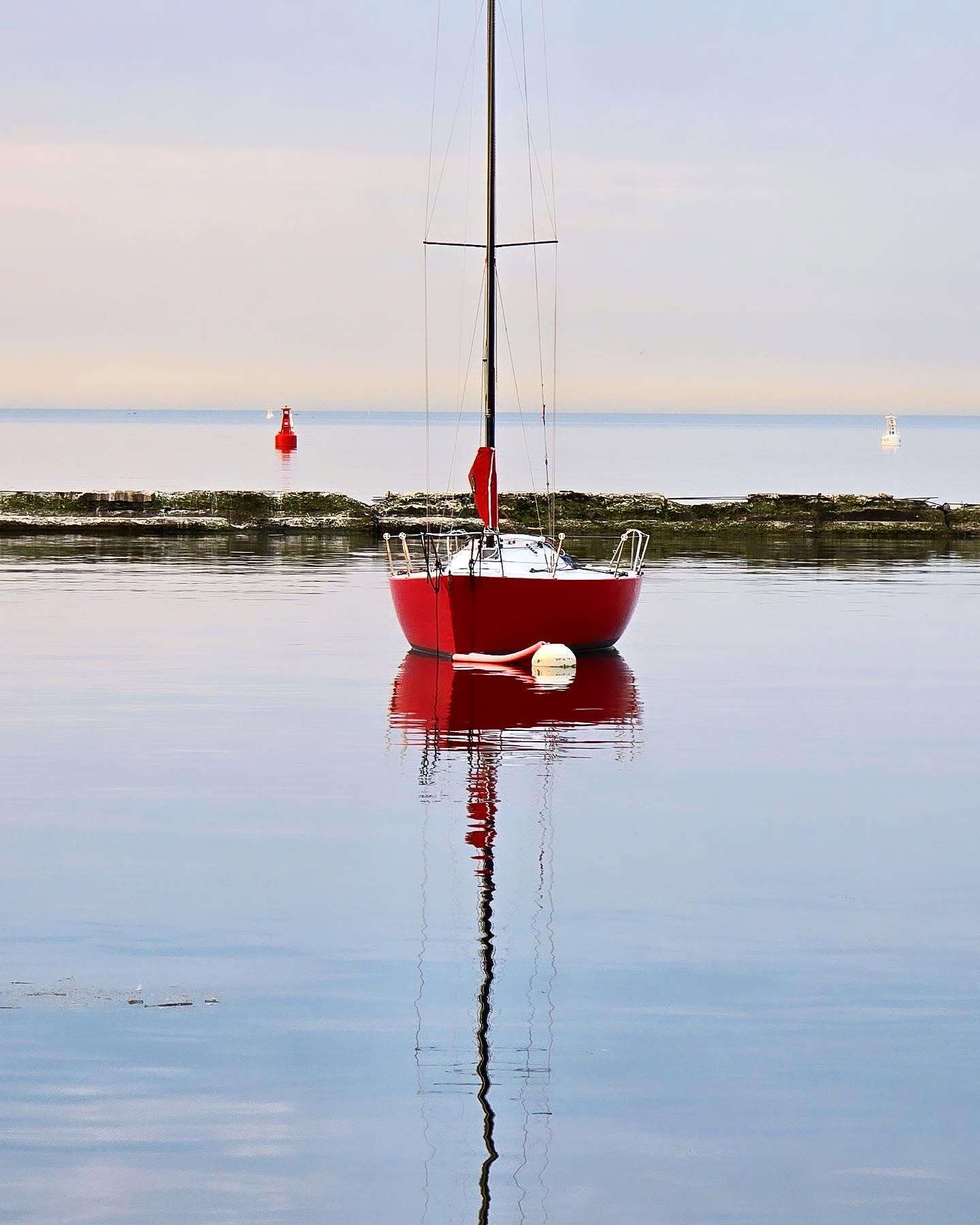 Sailboats on the water by Coronation Park on the Toronto waterfront
