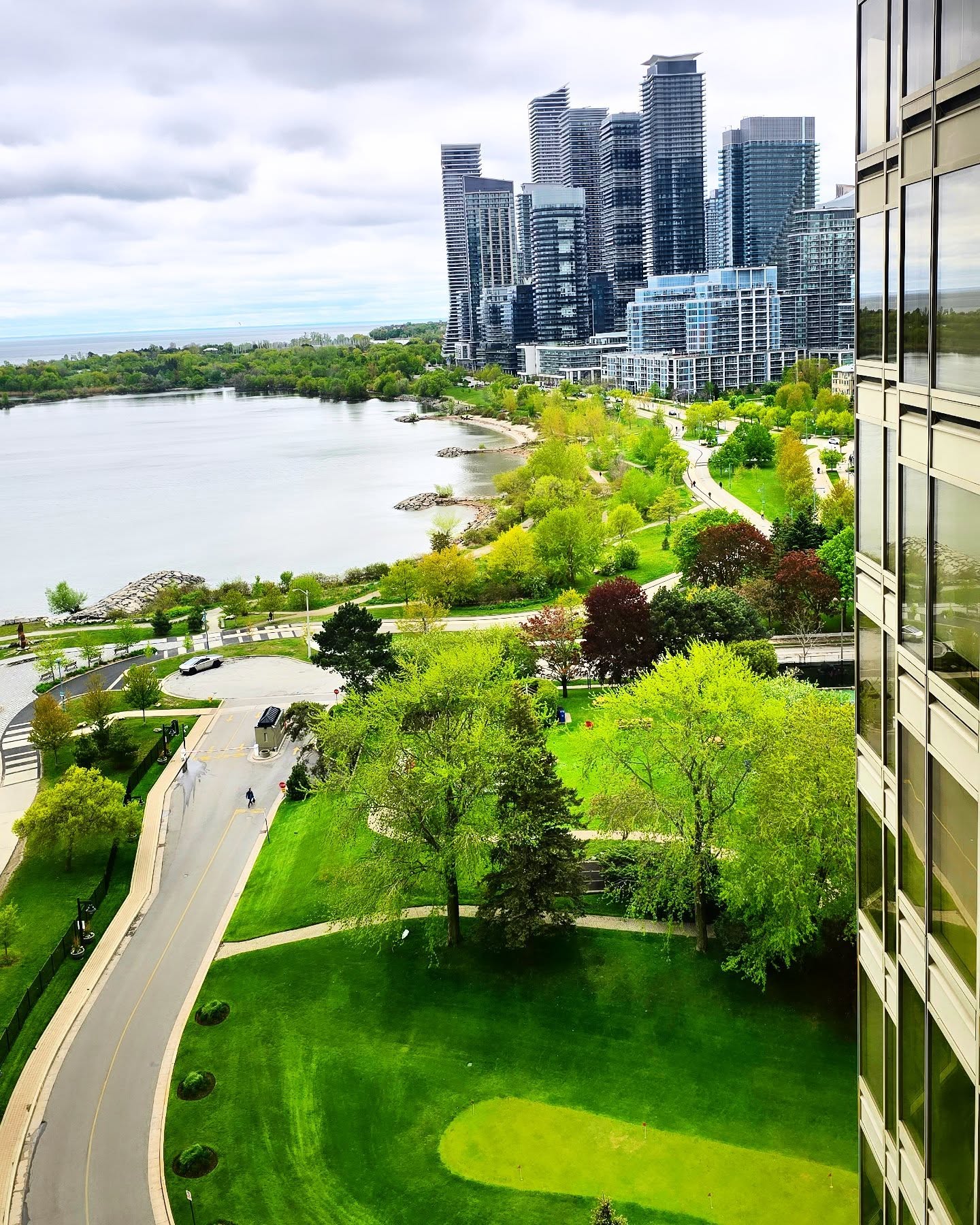 Aerial view of the Palace Place condo tower and Humber Bay waterfront