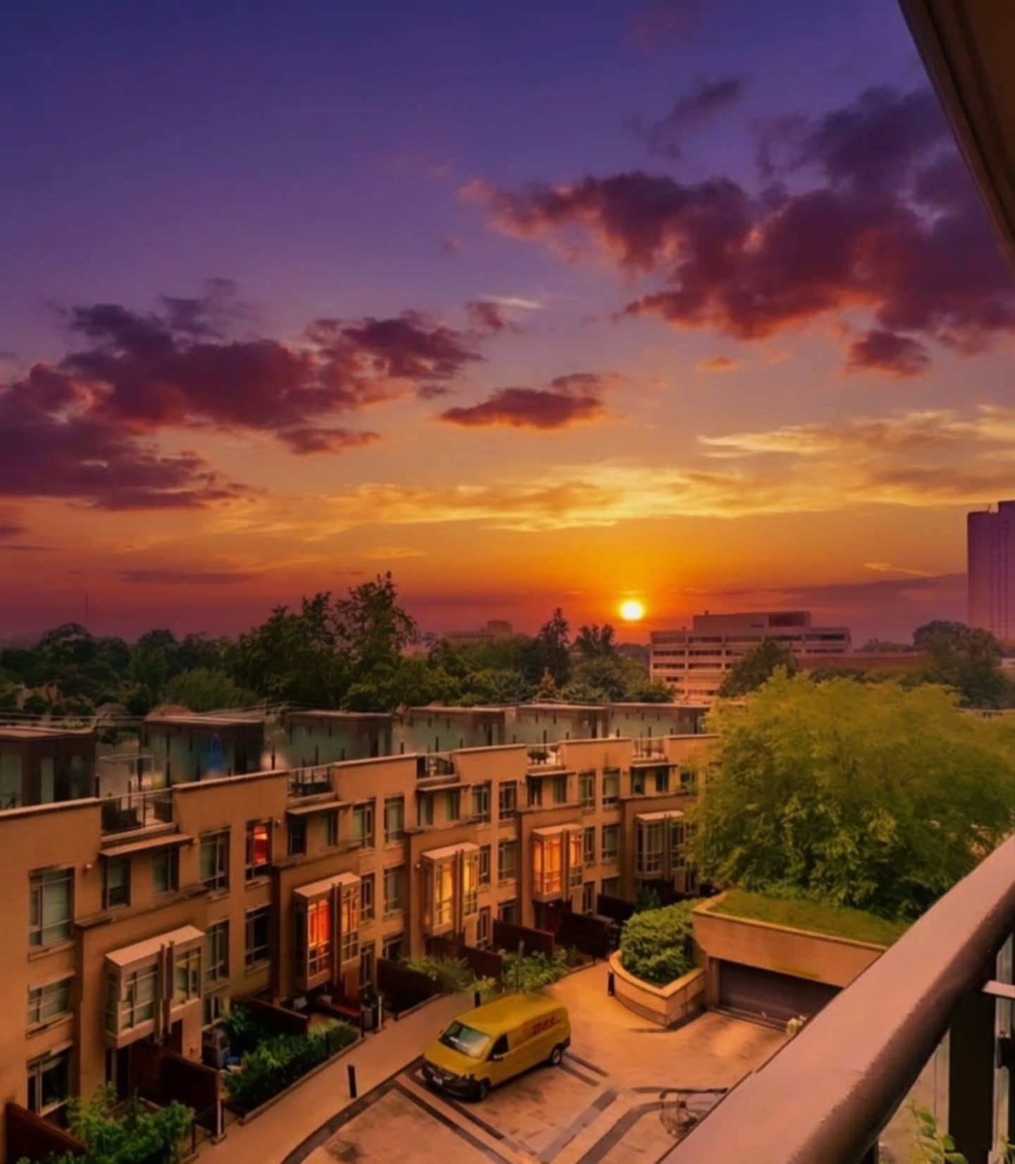 Sunset view over midtown Toronto rooftops from 60 Berwick Avenue