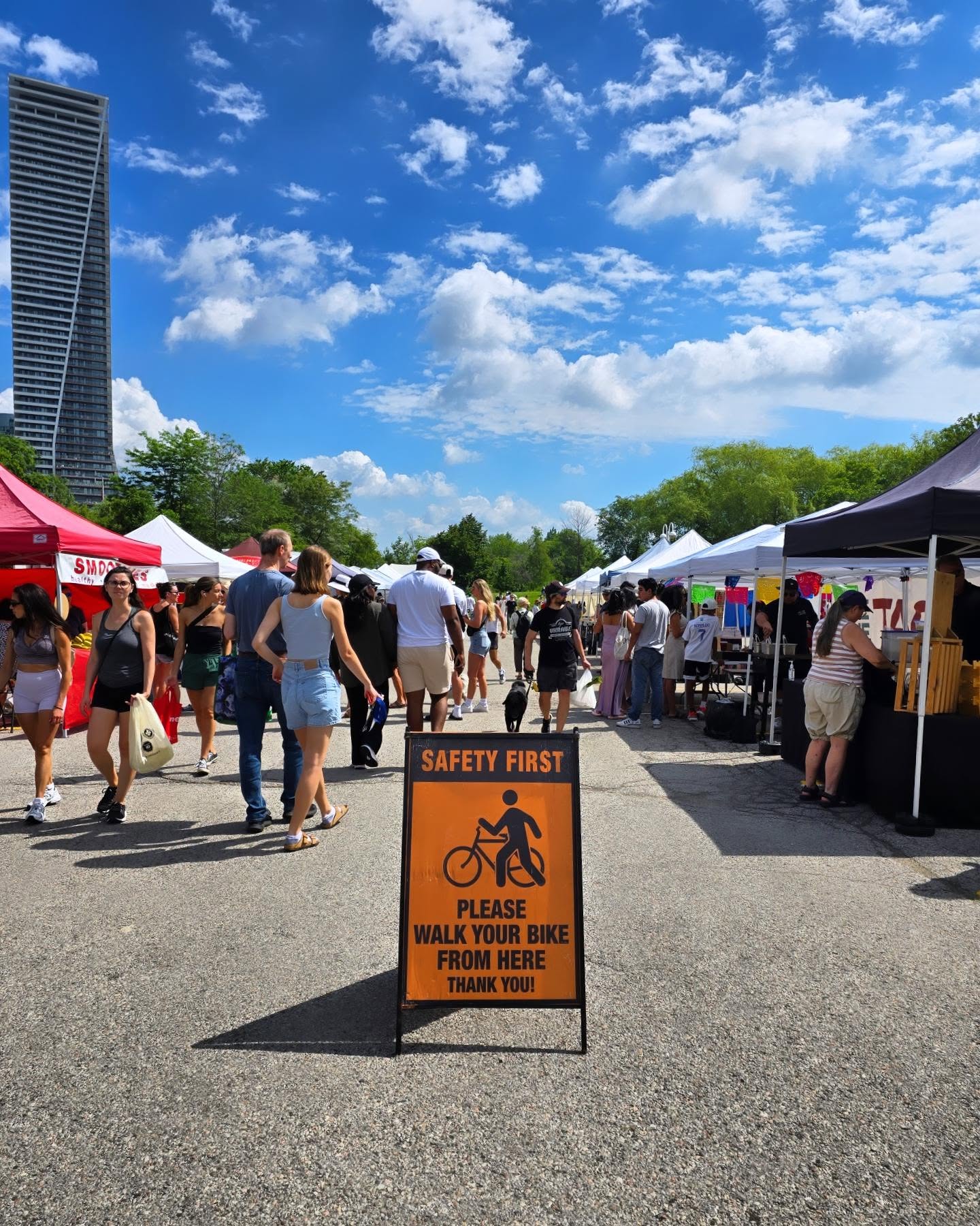 Vendor tents and crowds at the Humber Bay Shores Farmers' Market