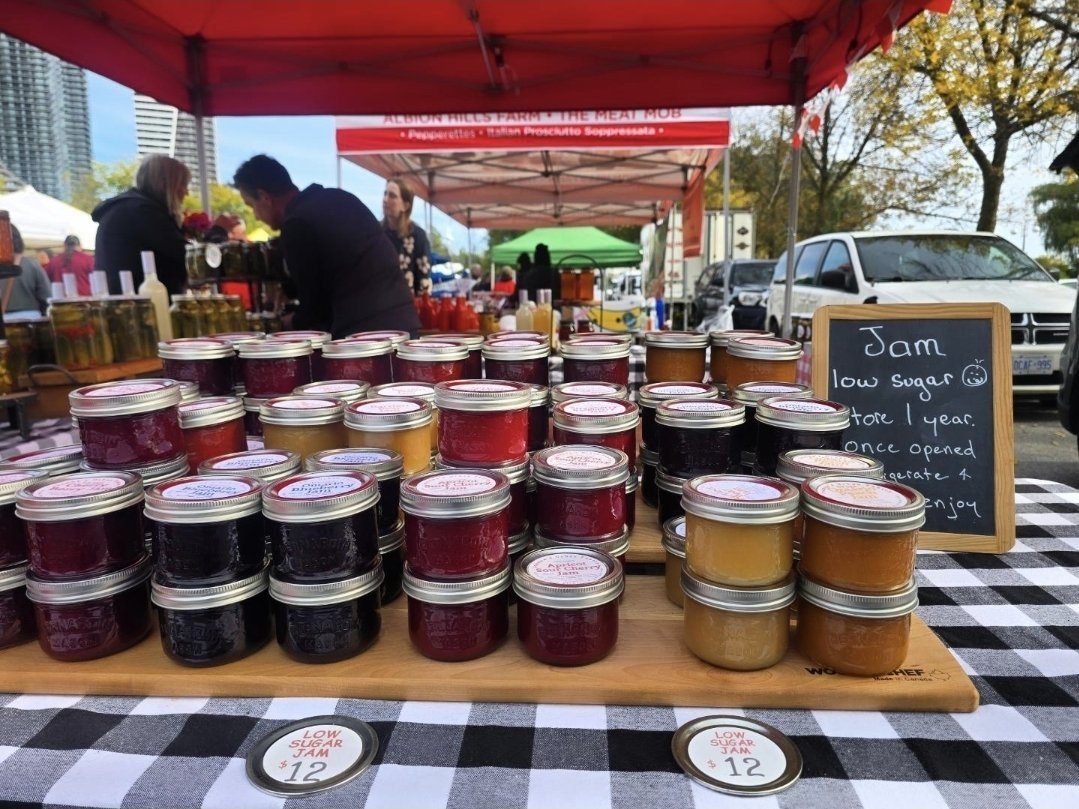 Rows of low-sugar jam jars at a preserves stall