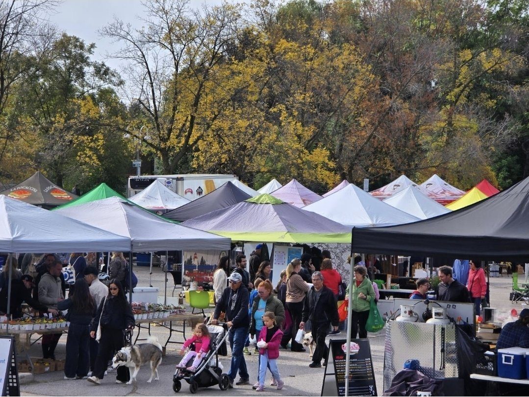 Crowds browsing vendor tents at the Humber Bay Shores Farmers' Market