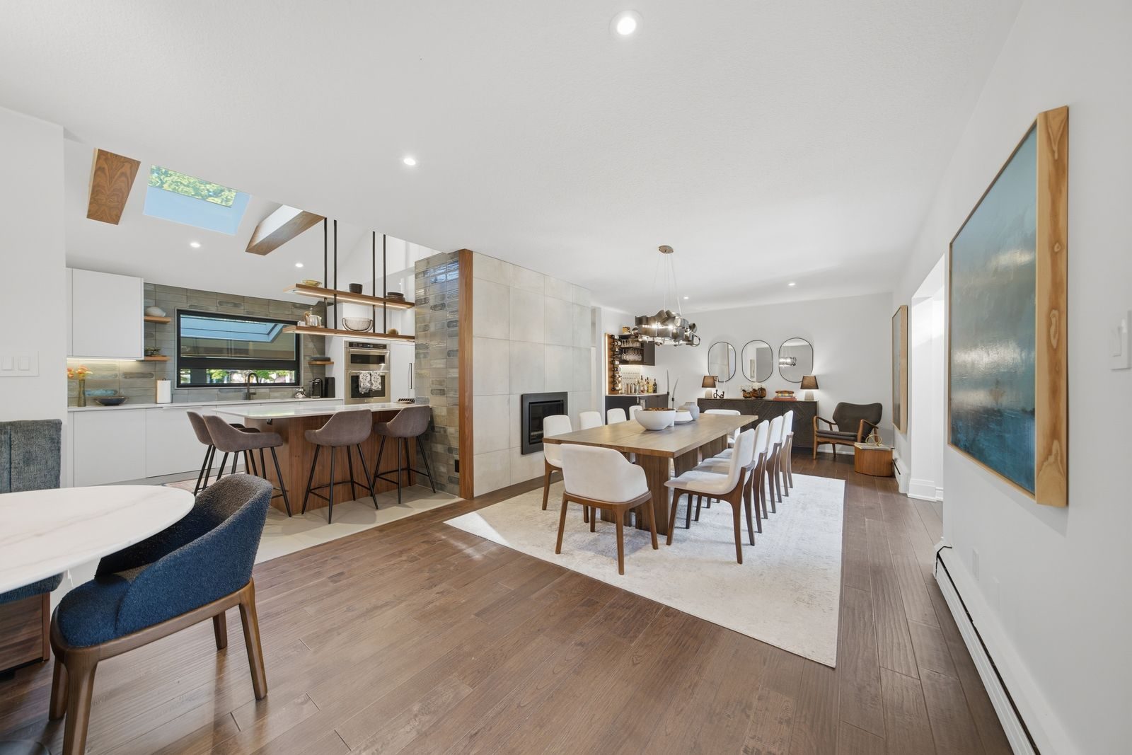 Staged open-plan main floor with kitchen, dining and living areas at 52 Morna Avenue, Guildwood, Scarborough, sold by Better Properties