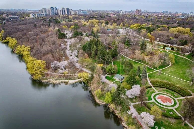 Aerial view of High Park in spring with nearby Toronto neighbourhoods in the distance