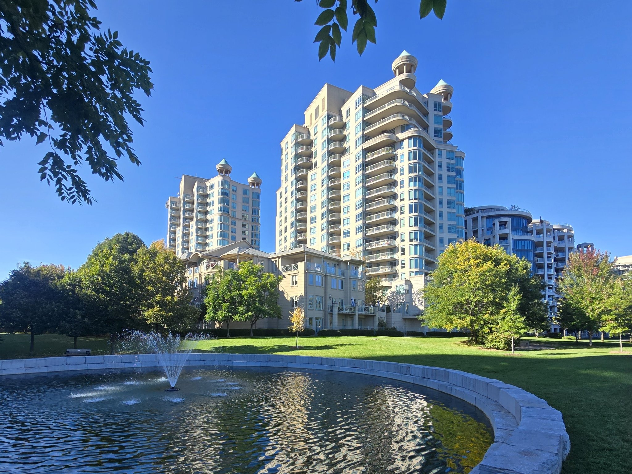 The fountain pond in Jean Augustine Park with Newport Beach Condominiums behind it, Humber Bay Shores
