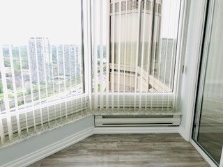 The solarium at 3911 - 1 Palace Pier Crt — corner windows overlooking the water