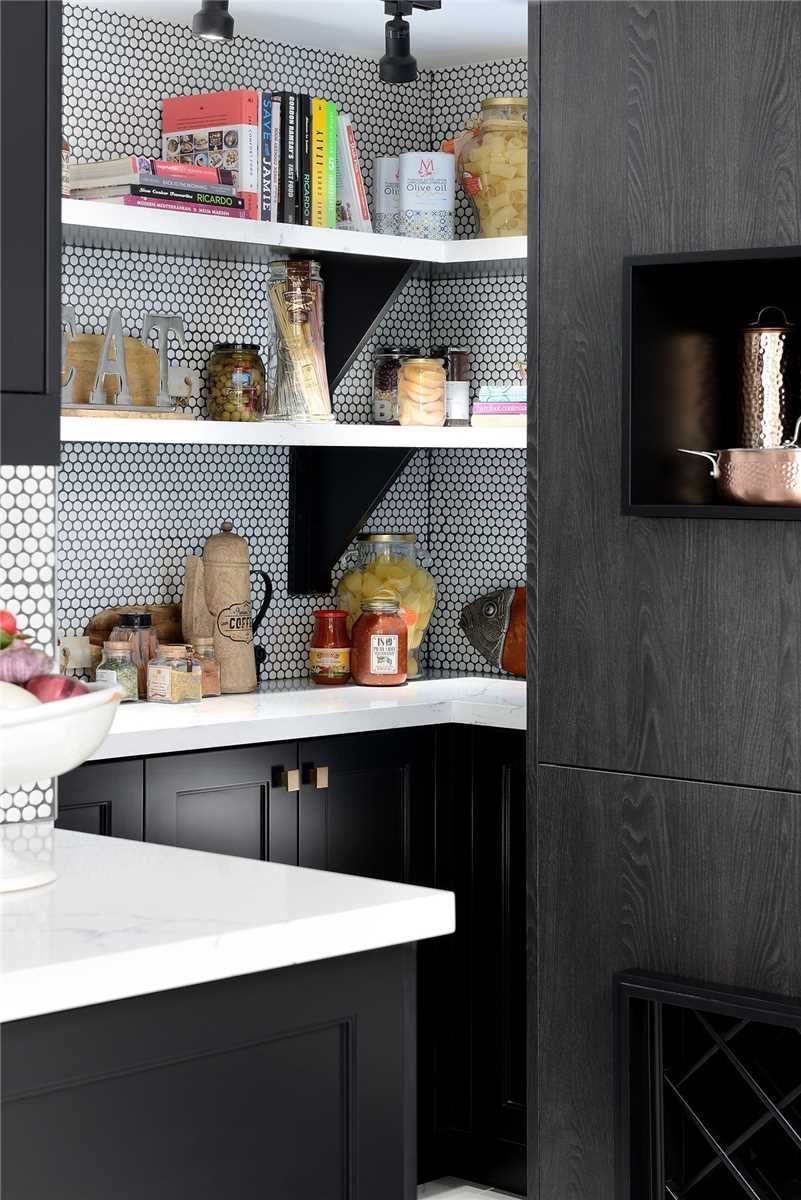 The pantry at 2201 - 1 Palace Pier Court — open shelving with cookbooks and dark lower cabinets