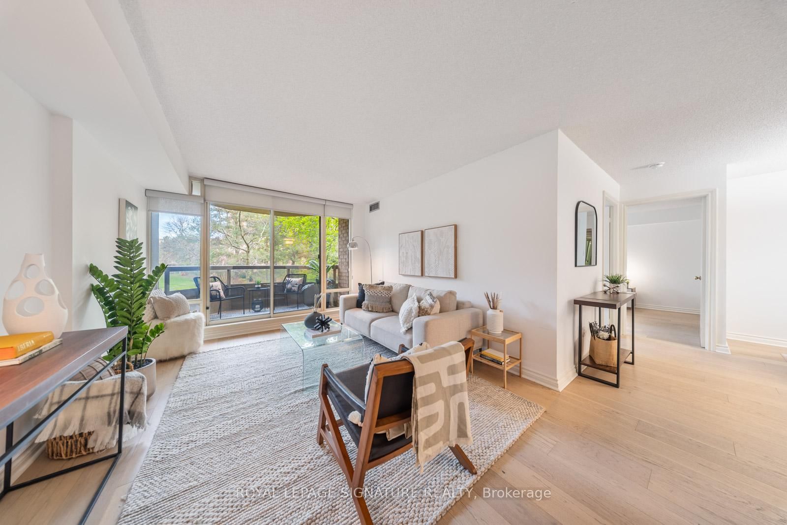 Living room with windows overlooking the gardens