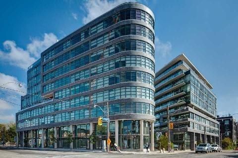 The curved Flatiron Lofts building at 1201 Dundas Street East, at Dundas and Carlaw in Leslieville