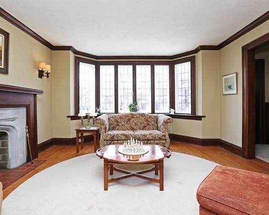Living room bay window with original leaded glass at 17 Courcelette Road, Toronto