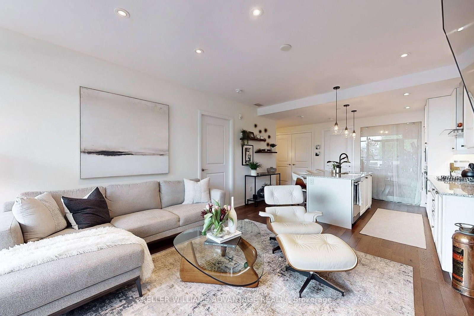 The living room at 308 - 200 Woodbine Avenue — bright open space with floor-to-ceiling windows