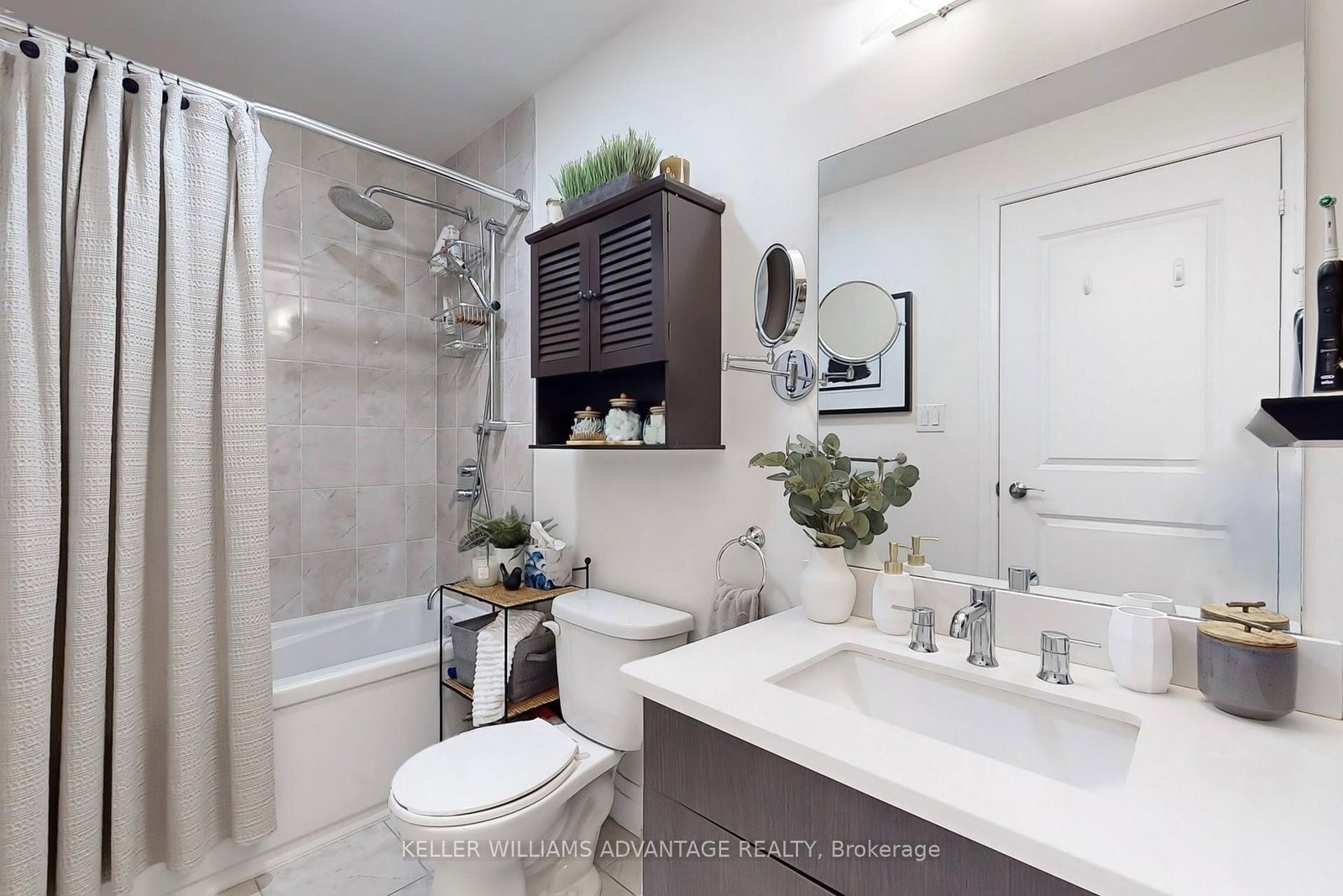 The bathroom at 308 - 200 Woodbine Avenue — tub, vanity and modern finishes