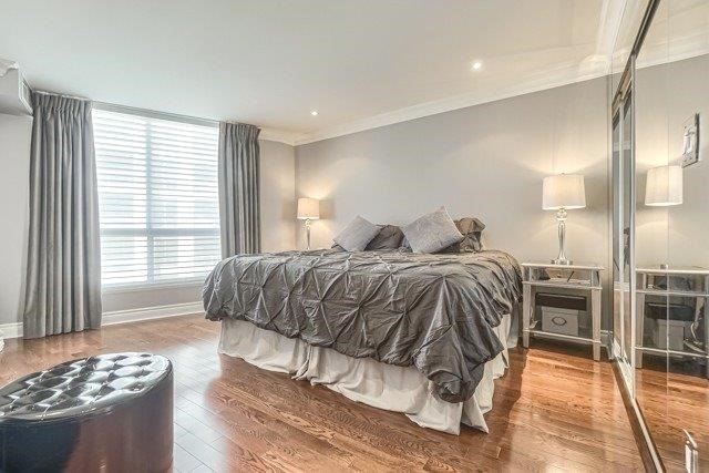 The master bedroom at 1709 - 2111 Lake Shore Blvd W — large window and hardwood floors