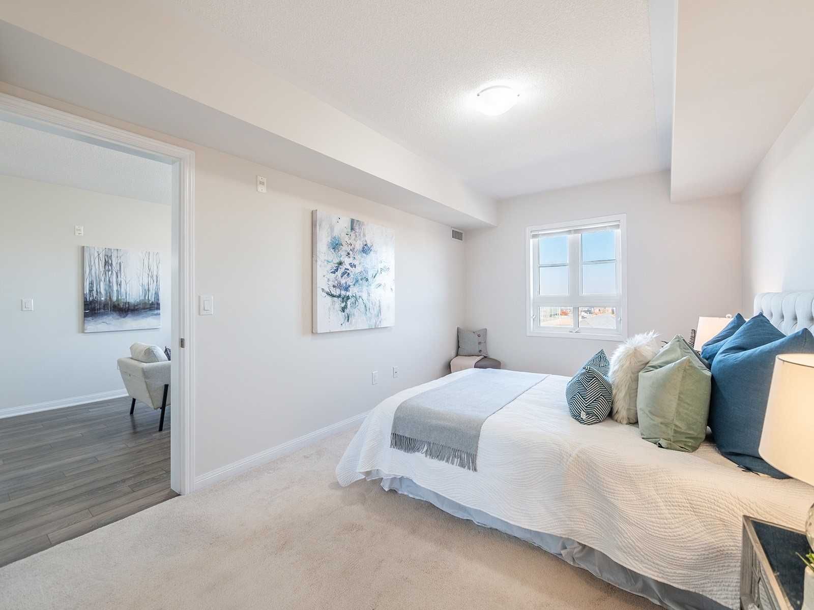 Primary bedroom with neutral d&eacute;cor and staged bedding