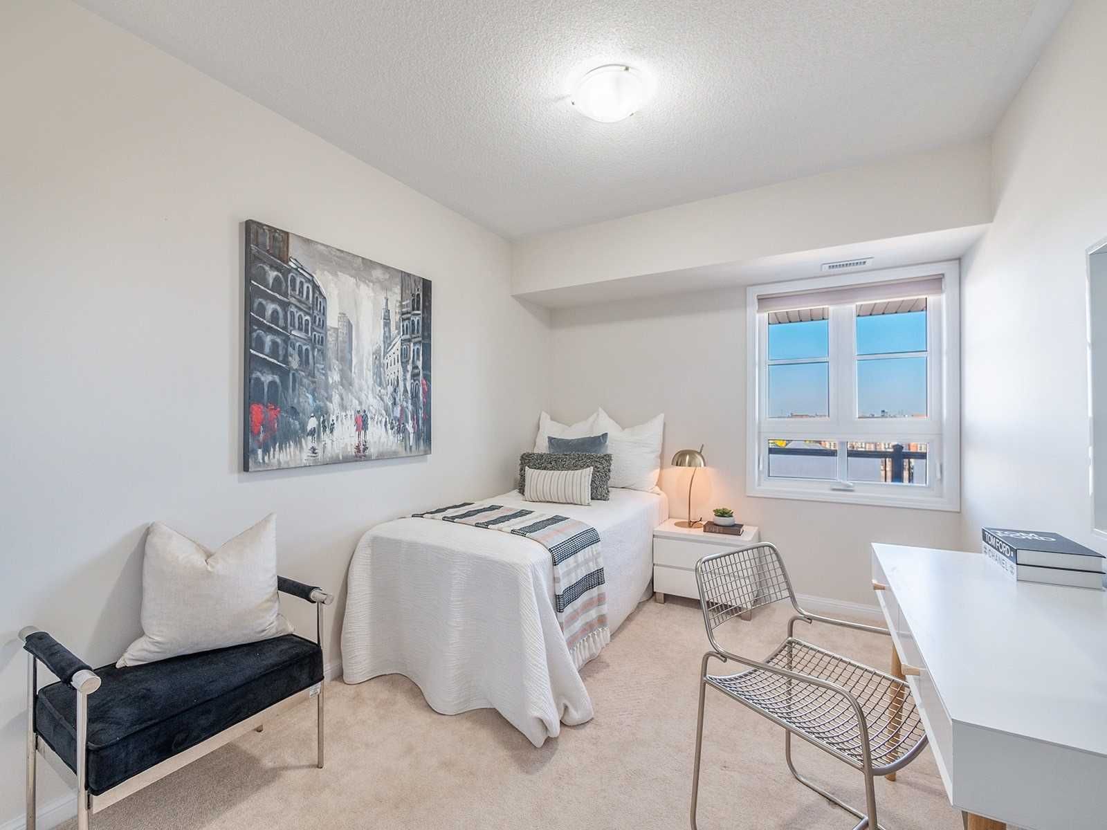 Second bedroom styled as a home office with daybed