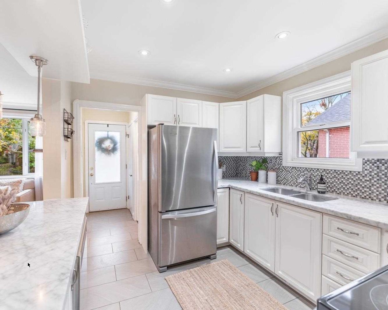 Kitchen with mosaic backsplash at 64 Delroy Drive